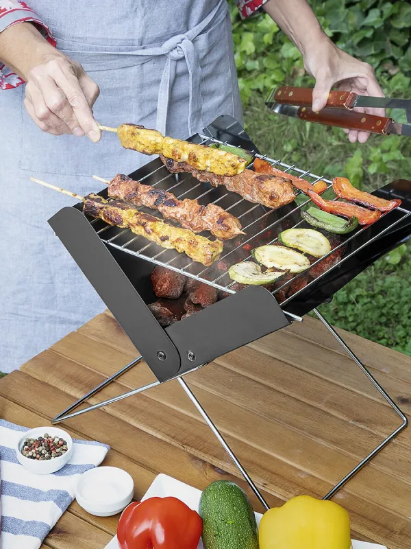 Produkt Mini skladací prenosný gril na drevené uhlie Foldecue InnovaGoods Obrázok
